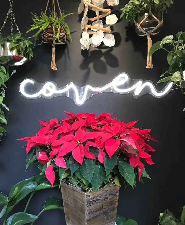 flower wall with neon sign